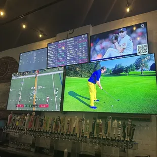 a man playing golf on a large screen
