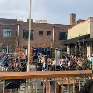 a man sitting at a table outside