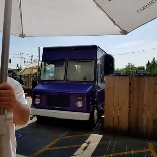 The food truck parked in the garden