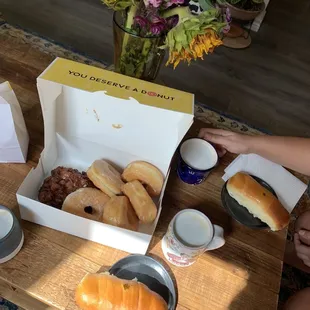 a box of doughnuts and coffee