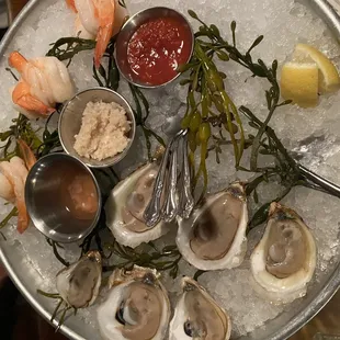 a platter of oysters and shrimp