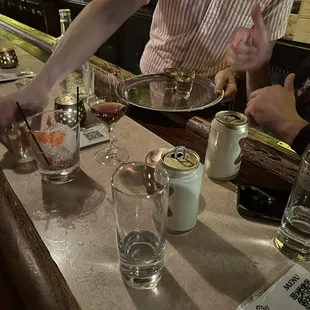 a woman serving food at a bar