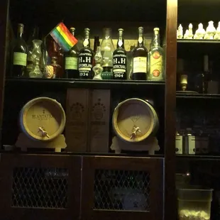 a shelf of liquor bottles