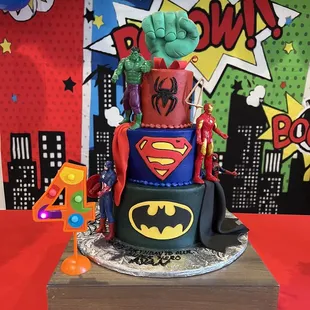 a cake decorated like a superhero
