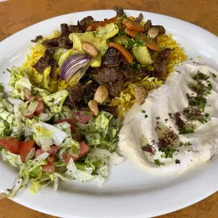 Lamb Mix Shawarma Plate Fresh lamb mix, saffron rice, hummus, salad, grilled veggies. Pita is included.