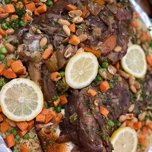 a platter of meat and vegetables