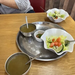 Two salads with complementary soup. There&apos;s also some sort of salsa which we used as a salad dressing.
