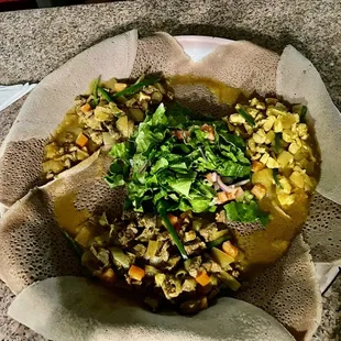 Injera bread with house salad, Alicha Tibs, Ye Beg Alicha Tibs and Alicha Tibs Derho. The chicken was very flavorful!