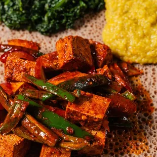 Tofu sautéed in olive oil with a roasted garlic sauce, Ethiopian spices, bell peppers, jalapeno and onions.