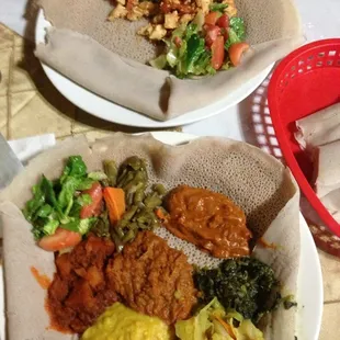 Veggie plate and chicken dish. Excellent #ethiopian food at Queen Sheba #charlotte #charlottenc