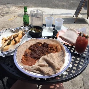 Lamb Qey Wat, mesir wat, collards, Ethiopian cheese steak sandwich and Bloody Mary :)