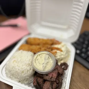 a meal in a styrofoam container