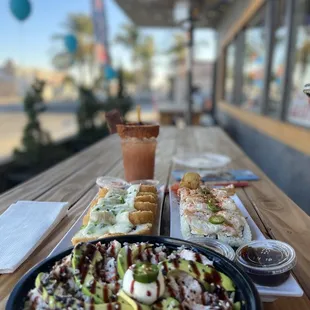 a plate of sushi and avocado