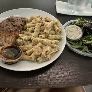 Pasta, salmon with teriyaki sauce and a caesar salad