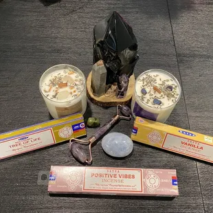 3 stone pillars, two small stones, stone roller, incense, and candles.