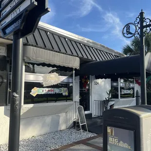 Outside on corner of Broadway St.