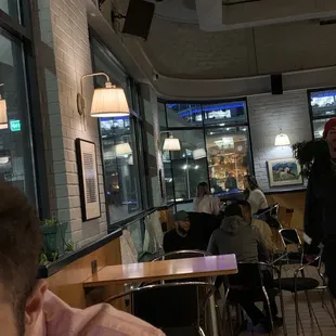 a man sitting at a table in a restaurant