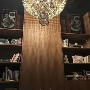 a chandelier and bookshelves