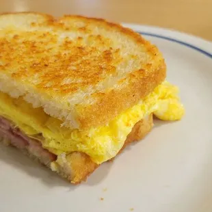 a breakfast sandwich on a plate