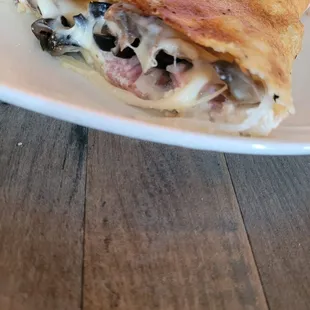 Calzone with shrooms, ricotta onion, ham n olives. Delish!