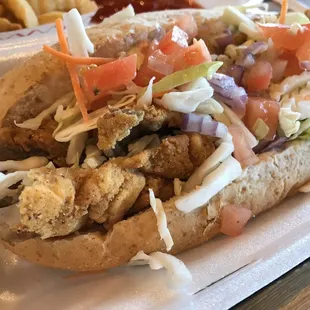 Fish boat $12 - overpriced, stingy toppings, lack of tarter sauce and a very dry meal.