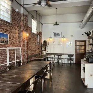 a long wooden table and chairs