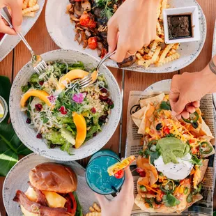 Papaya Salad with Quinoa, Nachos, Wagyu burger, QB Fried Chicken Sandwich, Fish Tacos, Kalua Pork Tacos, Grilled Steak with Hamakua Mushroom