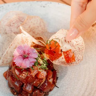 Fresh Ahi Poke with Line Caught Fresh Ahi, Kukui Nut, Ogo (seaweed), Maui Onions, Shoyu (soy sauce) Vinaigrette, Housemade Taro Chips