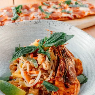 Kauai Shrimp Pad Thai with Local Farm Egg, Fish Sauce, Garlic Chive , Peppers, Pickled Radish, Bean Sprouts, Tofu, Lime, Thai Basil, Peanuts