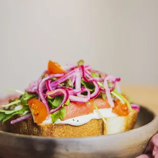 a person holding a plate of food