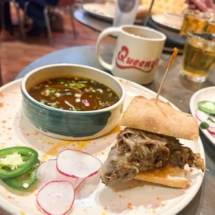 a plate with a sandwich and a bowl of soup