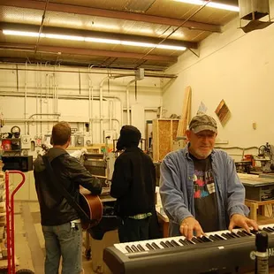 Folks Tinkering and playing in the Woodshop