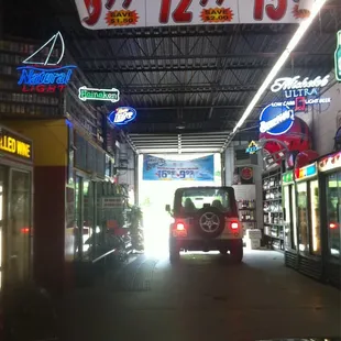 a car driving through a gas station