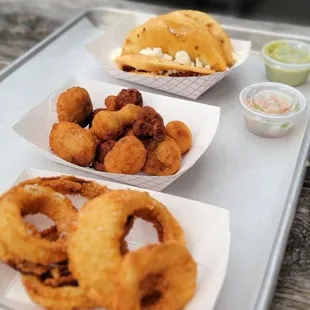 Onion rings, fried mushrooms and pulled pork puffy tacos