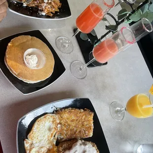Chilaquiles and country fried steak with pancakes
