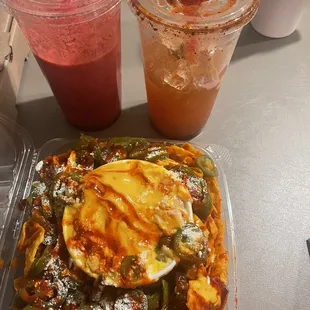 two drinks and a plate of nachos