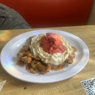 Funnel cake with strawberry ice cream