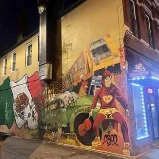 a mexican flag painted on the side of a building