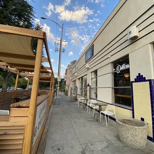 Front with outdoor seating. On a very quiet street.