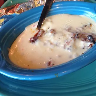 a bowl of soup with a spoon in it