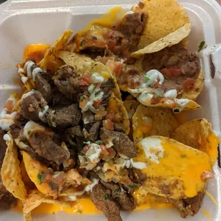 Nacho Mama and they're right. Fake canned cheese and beans. Meat was good but some chewy pieces.