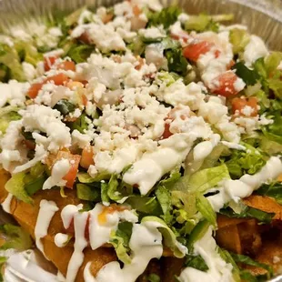 a salad in a foil container