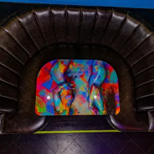 a dog sitting in a leather chair