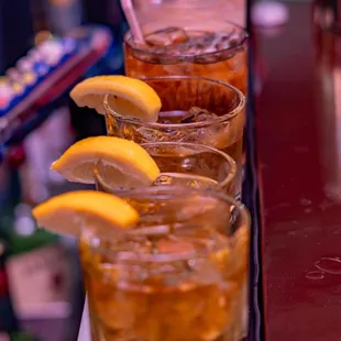 a row of glasses filled with drinks