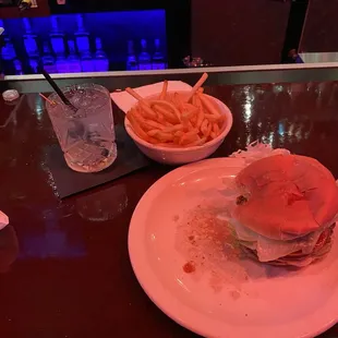 Drink with a burger and fries