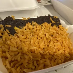 rice and black beans in a styrofoam container