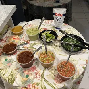 Variety of salsas mild, medium and hot. Pineapple salsa is so delicious and the guacamole and chopped cilantro and onion.