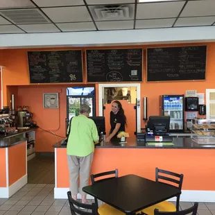 a man and a woman standing at a counter