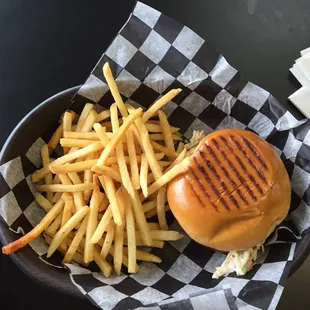 a hamburger and fries in a basket