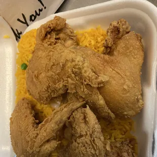 fried chicken and rice in a styrofoam container